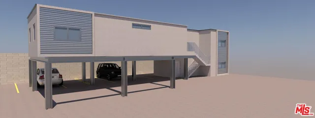 a living room with a table and windows