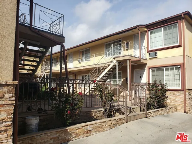 a front view of a house with parking