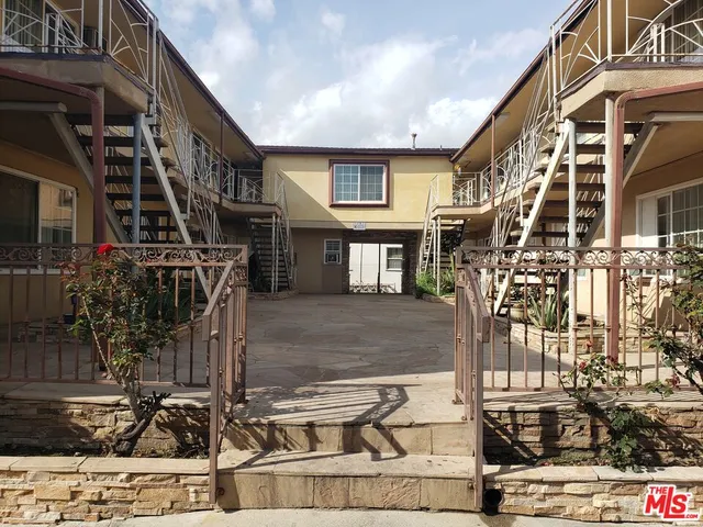 a front view of a house with parking