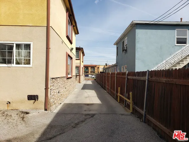 a view of a balcony with wooden fence