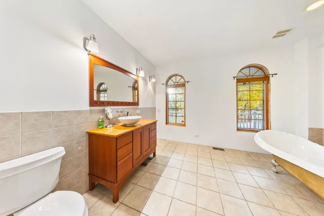 a bathroom with a sink a bathtub and a toilet