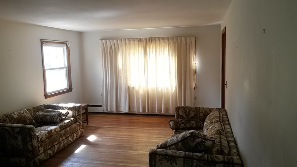 65 Timber Lane Springfield, MA 01119 - Photo 14 of 28 a living room with furniture and a large window