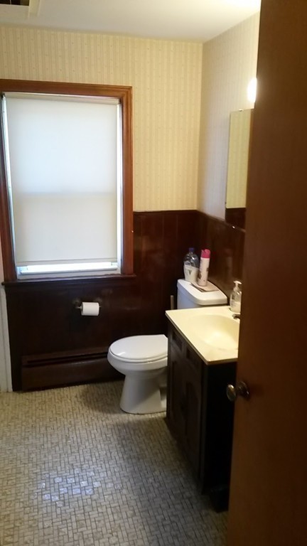 65 Timber Lane Springfield, MA 01119 - Photo 18 of 28 a bathroom with a sink a toilet and mirror