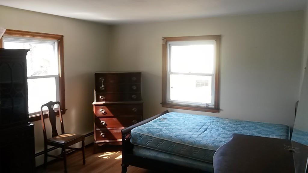 65 Timber Lane Springfield, MA 01119 - Photo 21 of 28 a bedroom with a bed and large windows