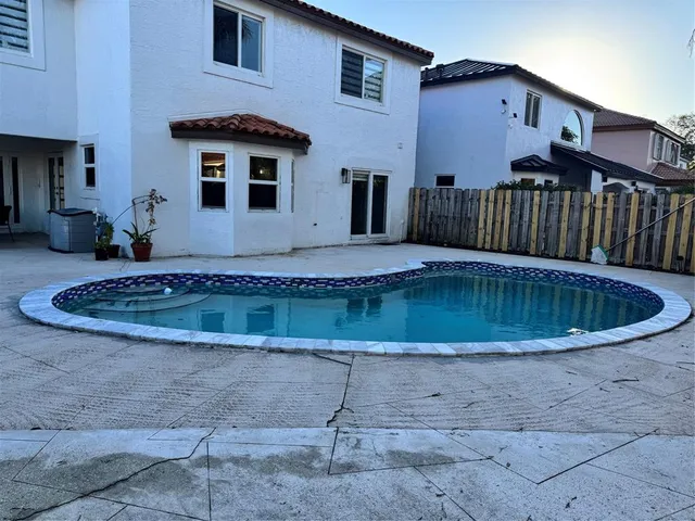 a view of a house with a swimming pool