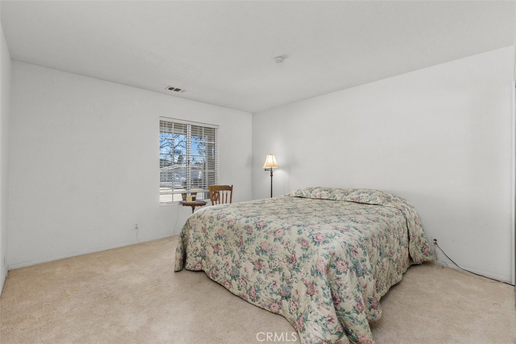 1765 Armadale Road Fallbrook, CA 92028 - Photo 21 of 45 a bedroom with a bed and window
