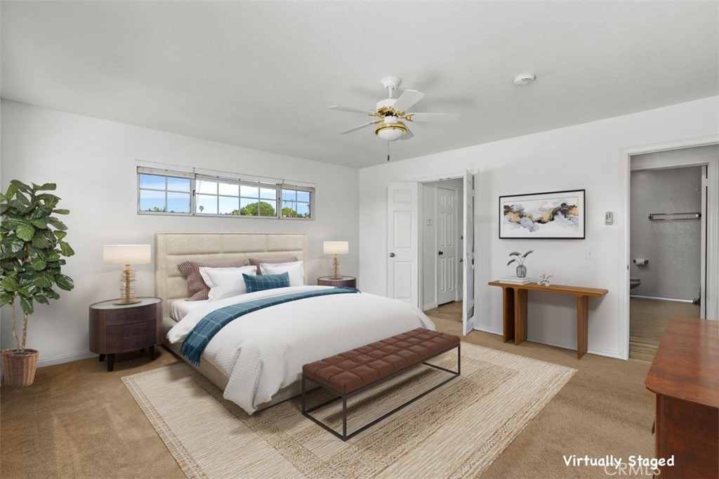 1765 Armadale Road Fallbrook, CA 92028 - Photo 27 of 45 a bedroom with a large bed and a chandelier