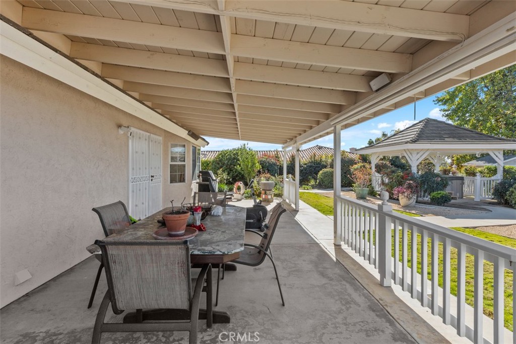 1765 Armadale Road Fallbrook, CA 92028 - Photo 32 of 45 a view of a patio with a table and chairs