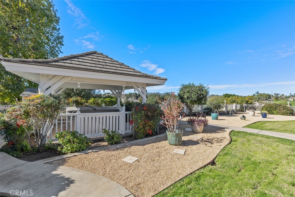 1765 Armadale Road Fallbrook, CA 92028 - Photo 33 of 45 a view of a patio with a table and chairs under an umbrella