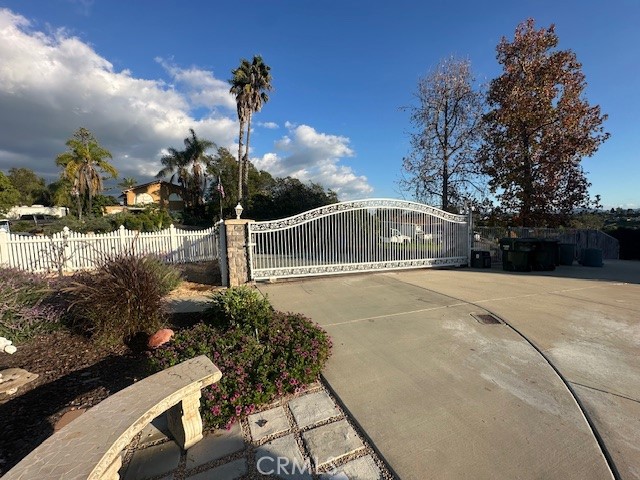 1765 Armadale Road Fallbrook, CA 92028 - Photo 4 of 45 a front view of a house with a yard and a fountain