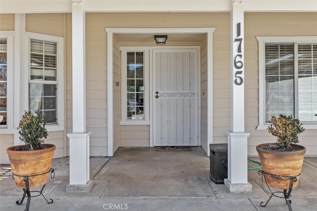 1765 Armadale Road Fallbrook, CA 92028 - Photo 7 of 45 a view of a chair and table and potted in the dinning room
