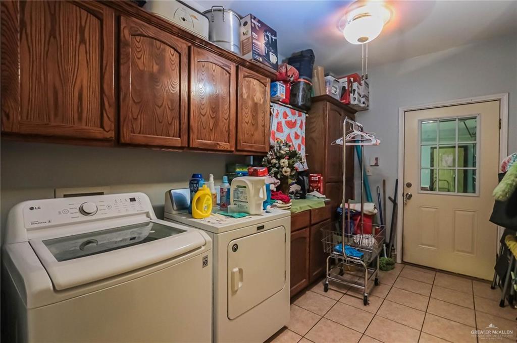 4701 Russell Circle Mission, TX 78574 - Photo 21 of 37 a view of storage and utility room with washer and dryer