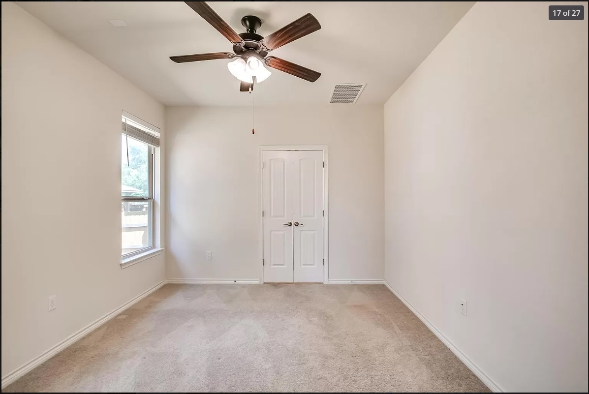 14215 McCoy Loop Austin, TX 78717 - Photo 14 of 27 Carpeted room featuring a ceiling fan with light fixture, window with blinds, and white double doors