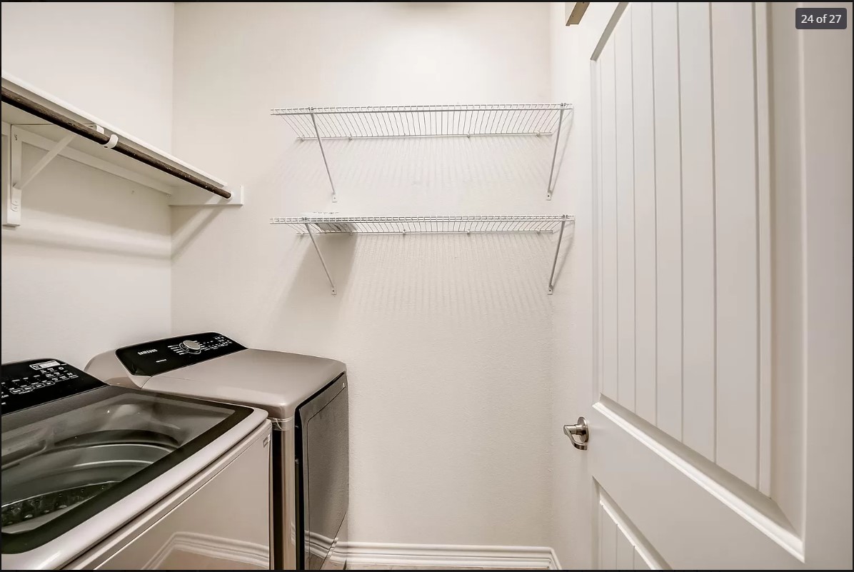14215 McCoy Loop Austin, TX 78717 - Photo 21 of 27 Utility area featuring white walls, overhead wire shelving, and a hanging rod