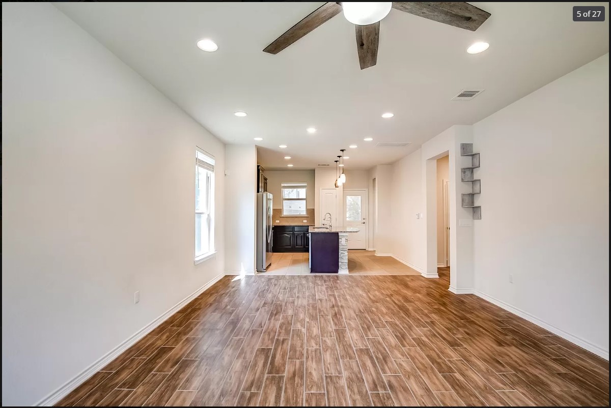 14215 McCoy Loop Austin, TX 78717 - Photo 23 of 27 Open-concept living space featuring wood-finish flooring, recessed lighting, and a ceiling fan