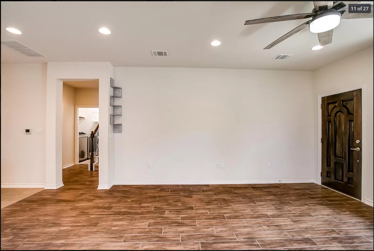 14215 McCoy Loop Austin, TX 78717 - Photo 8 of 27 Spacious room featuring wood-finish flooring, recessed lighting, and a contemporary ceiling fan