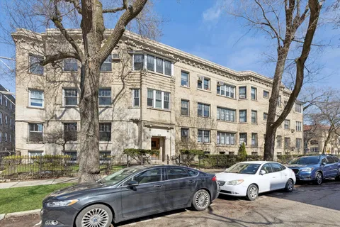 a front view of a building with parking space