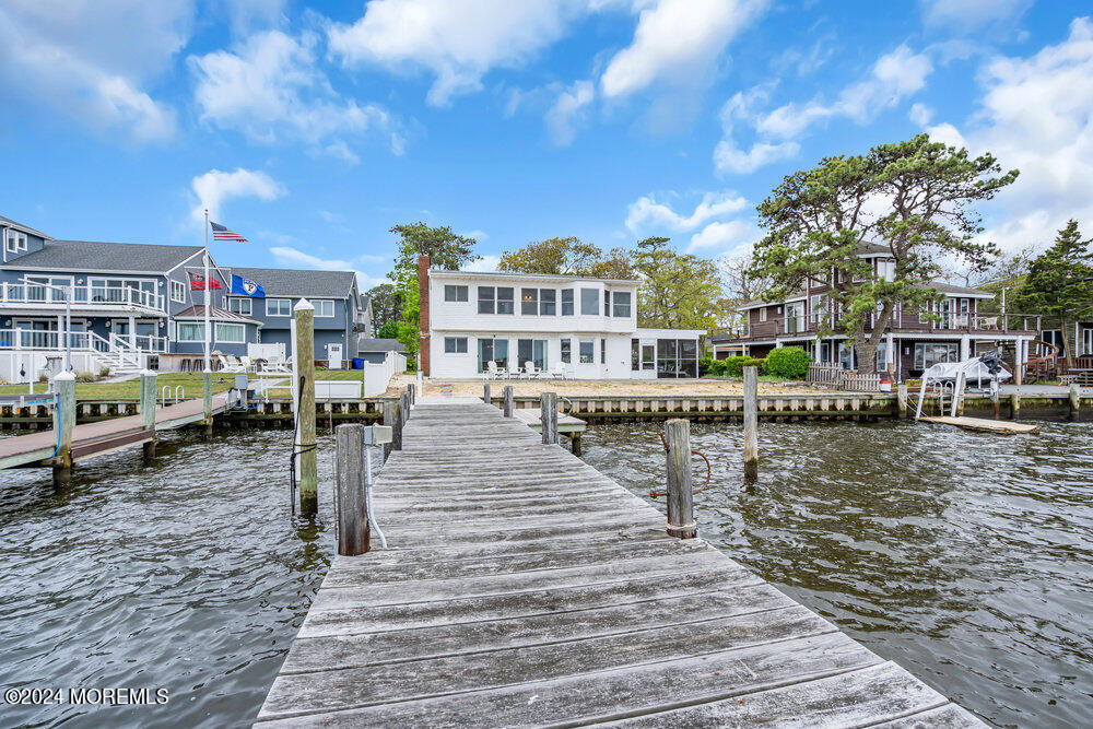402 A Mantoloking Road Brick, NJ 08723 - Photo 1 of 51 a lake view with tall buildings