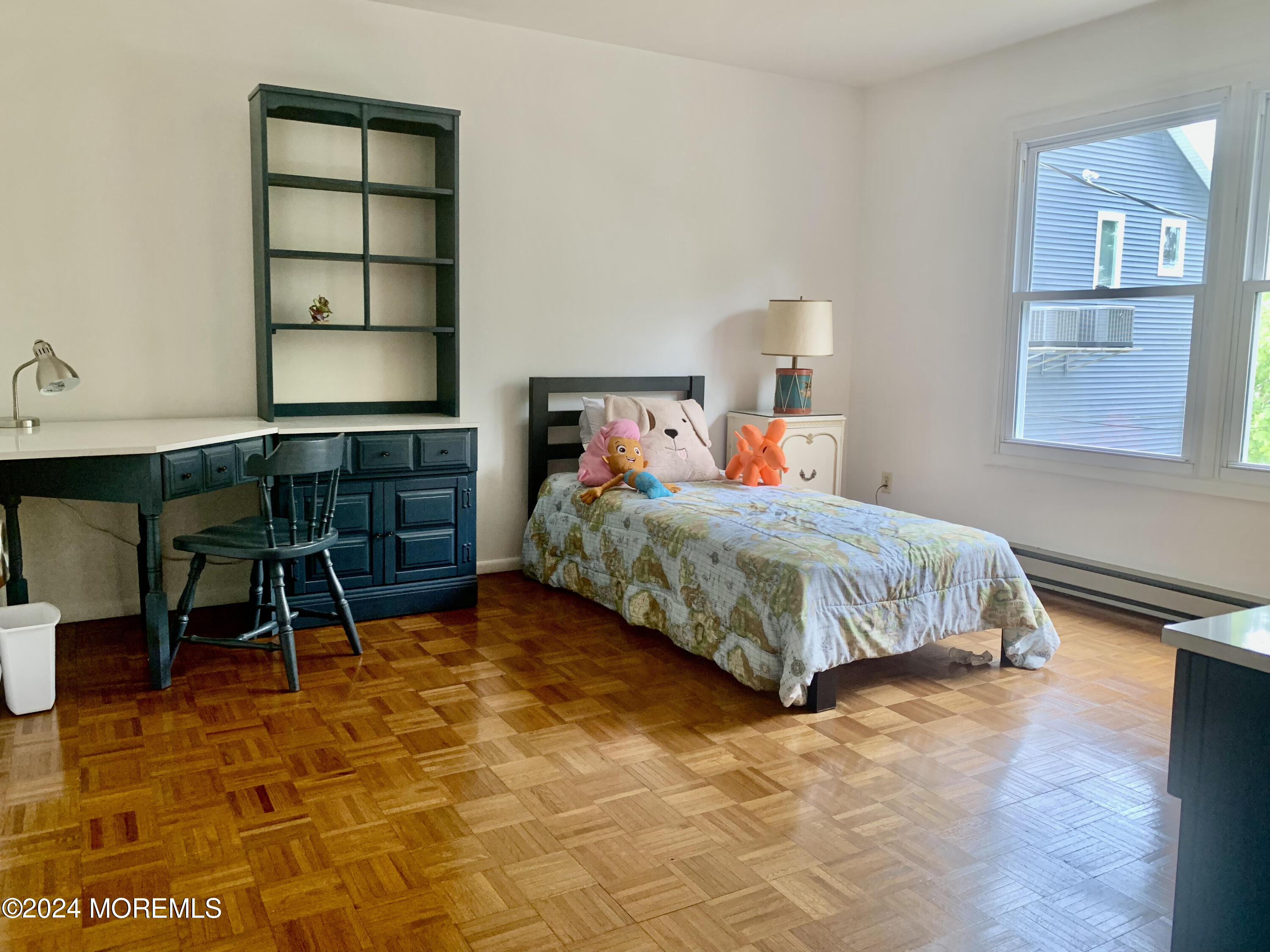 402 A Mantoloking Road Brick, NJ 08723 - Photo 23 of 51 a bedroom with a bed a table and chair