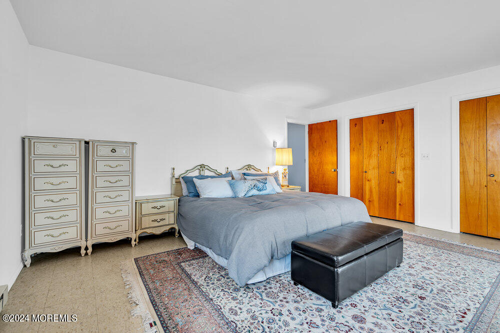 402 A Mantoloking Road Brick, NJ 08723 - Photo 28 of 51 a bed sitting in a spacious bedroom next to a window