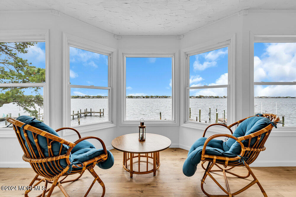 402 A Mantoloking Road Brick, NJ 08723 - Photo 29 of 51 a balcony with furniture and wooden floor