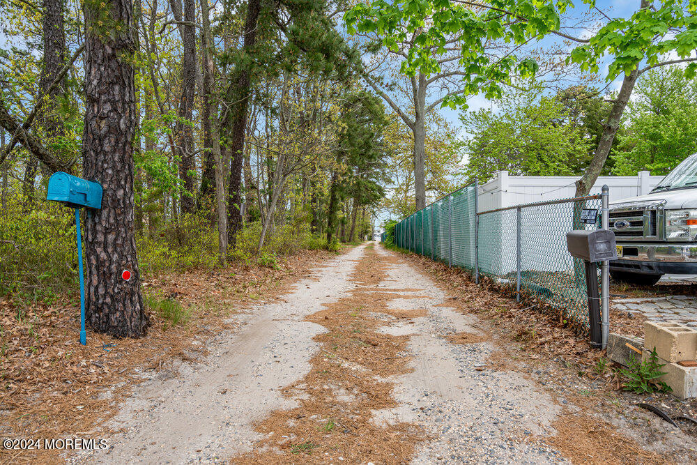402 A Mantoloking Road Brick, NJ 08723 - Photo 50 of 51 a backyard of a house with lots of green space