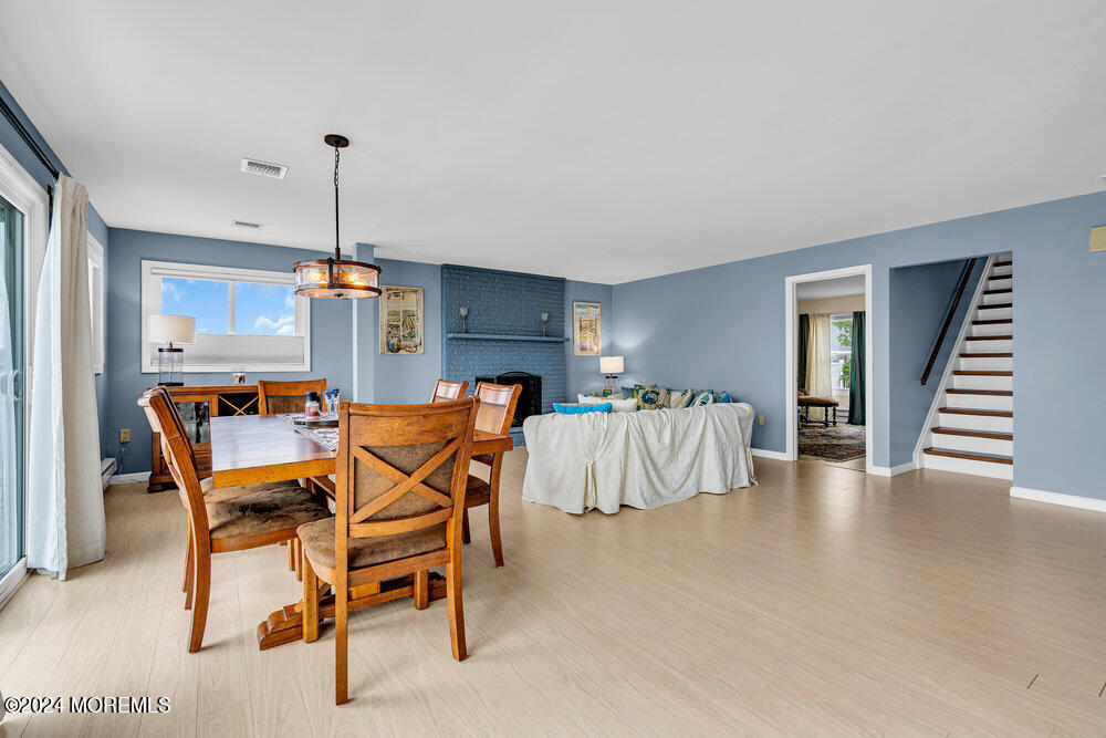 402 A Mantoloking Road Brick, NJ 08723 - Photo 5 of 51 a dining room with furniture and wooden floor