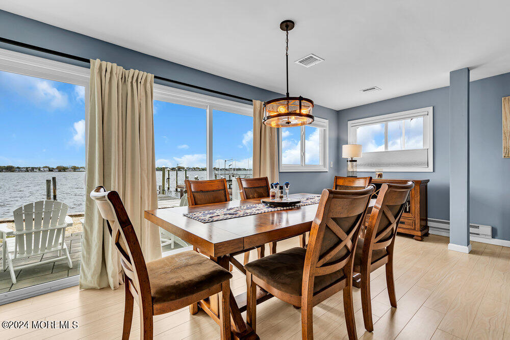 402 A Mantoloking Road Brick, NJ 08723 - Photo 6 of 51 a view of a dining room with furniture window and wooden floor