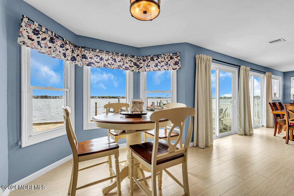 402 A Mantoloking Road Brick, NJ 08723 - Photo 7 of 51 a dining room with a table and chairs