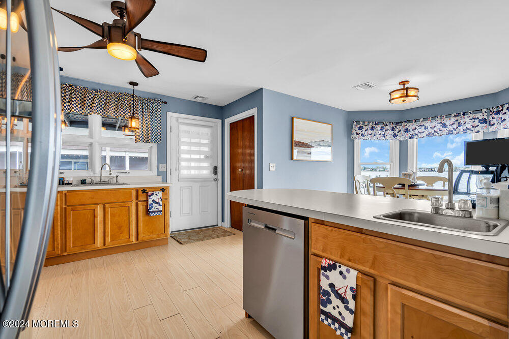 402 A Mantoloking Road Brick, NJ 08723 - Photo 8 of 51 a kitchen with stainless steel appliances granite countertop a sink and cabinets