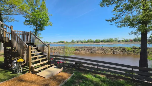 a view of a lake with a building in the background
