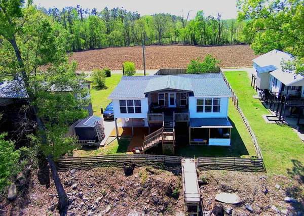 an aerial view of a house with yard swimming pool and outdoor seating