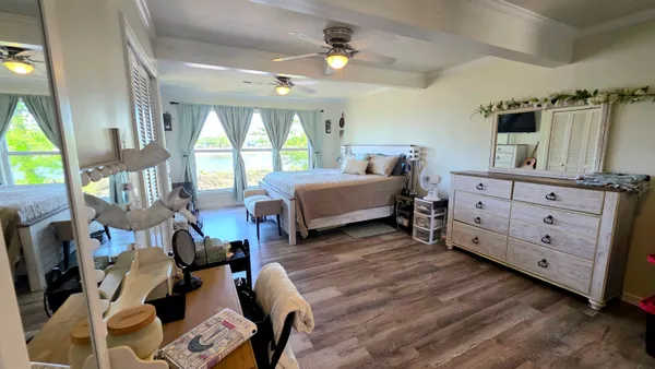 a bedroom with furniture and a window
