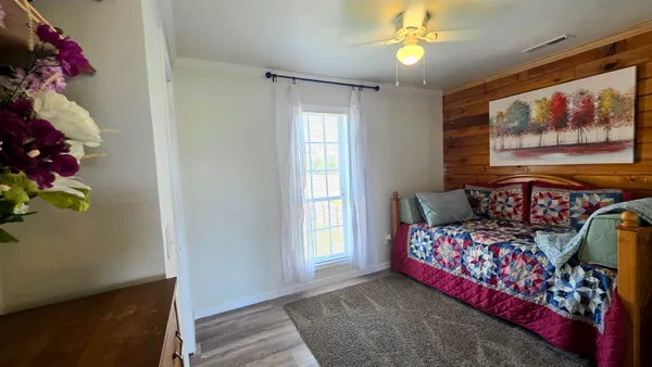 a bedroom with bed and a window