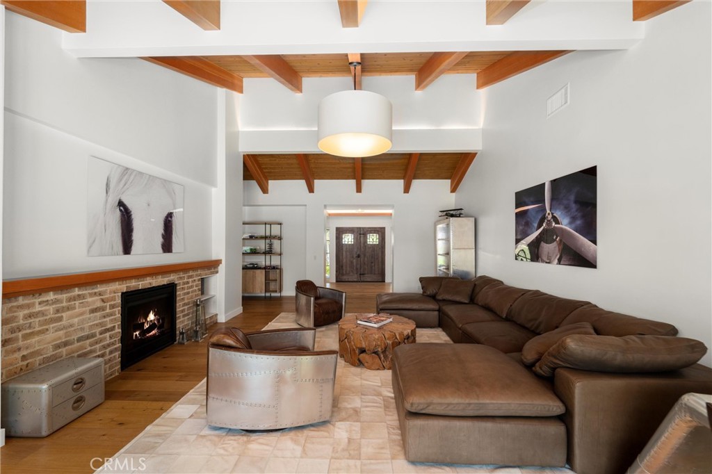7337 La Soldadera Rancho Santa Fe, CA 92067 - Photo 20 of 60 a living room with furniture and a fireplace