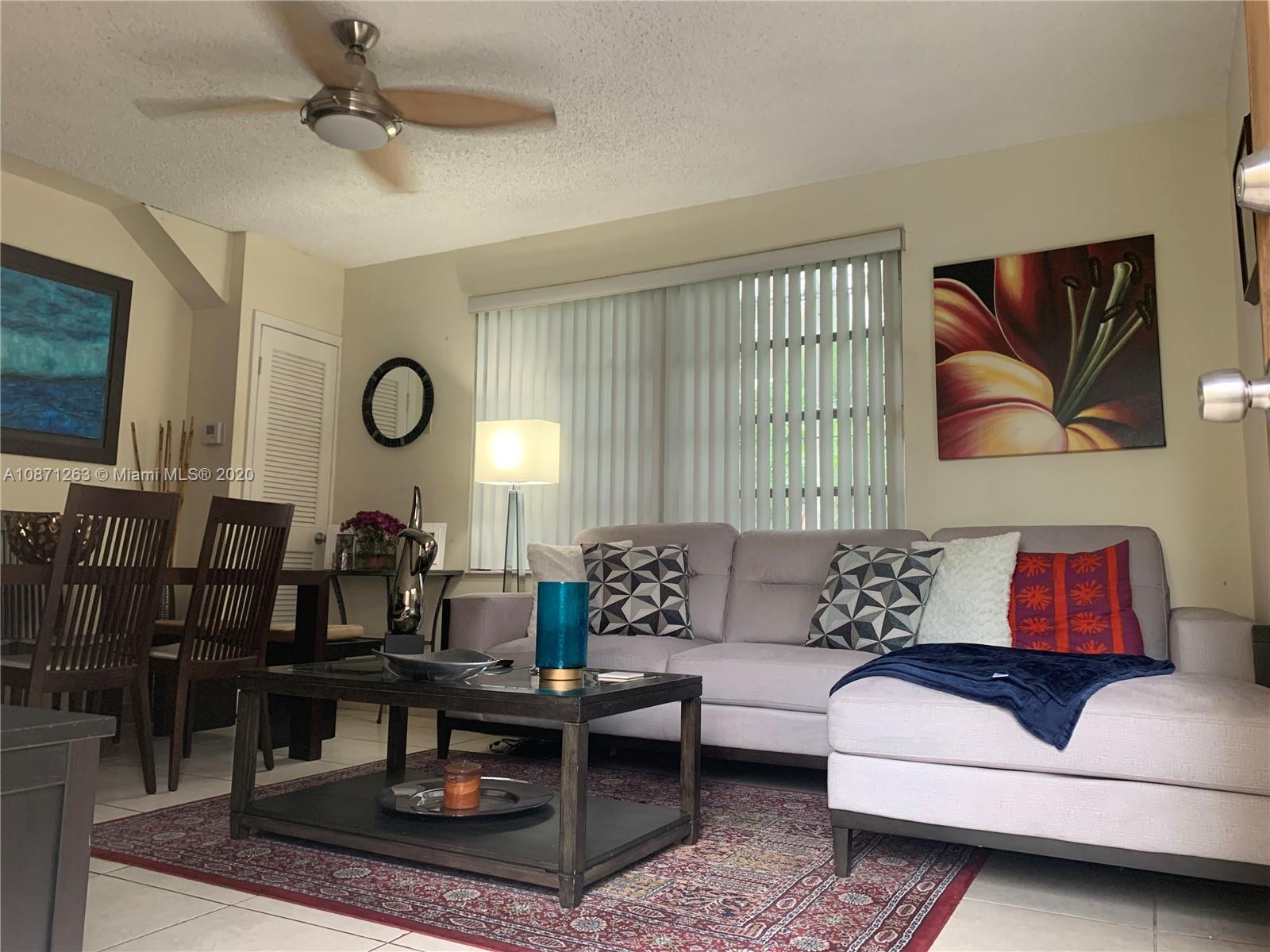 105 Southwest 22nd Road Miami, FL 33129 - Photo 17 of 26 a living room with furniture and a rug