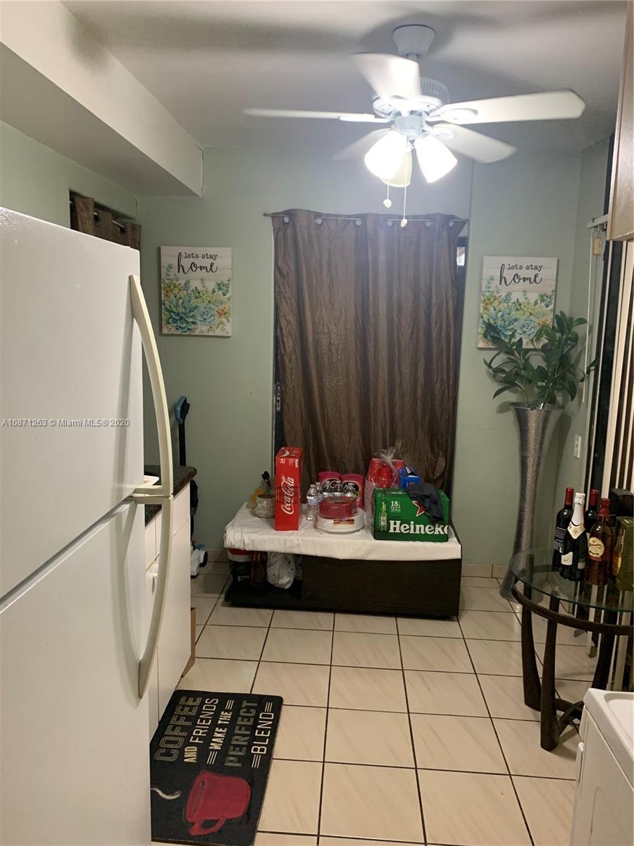 105 Southwest 22nd Road Miami, FL 33129 - Photo 24 of 26 a view of entryway with furniture and a chandelier