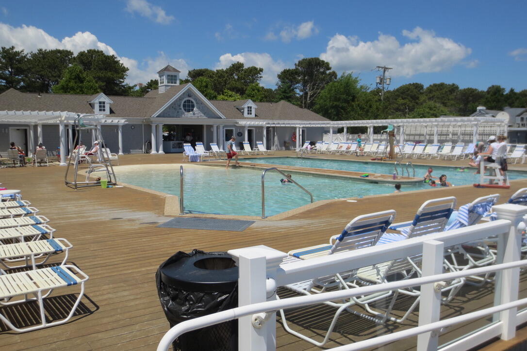 4 Colemans Way Mashpee, MA 02649 - Photo 26 of 27 a front view of house with outdoor space swimming pool and seating