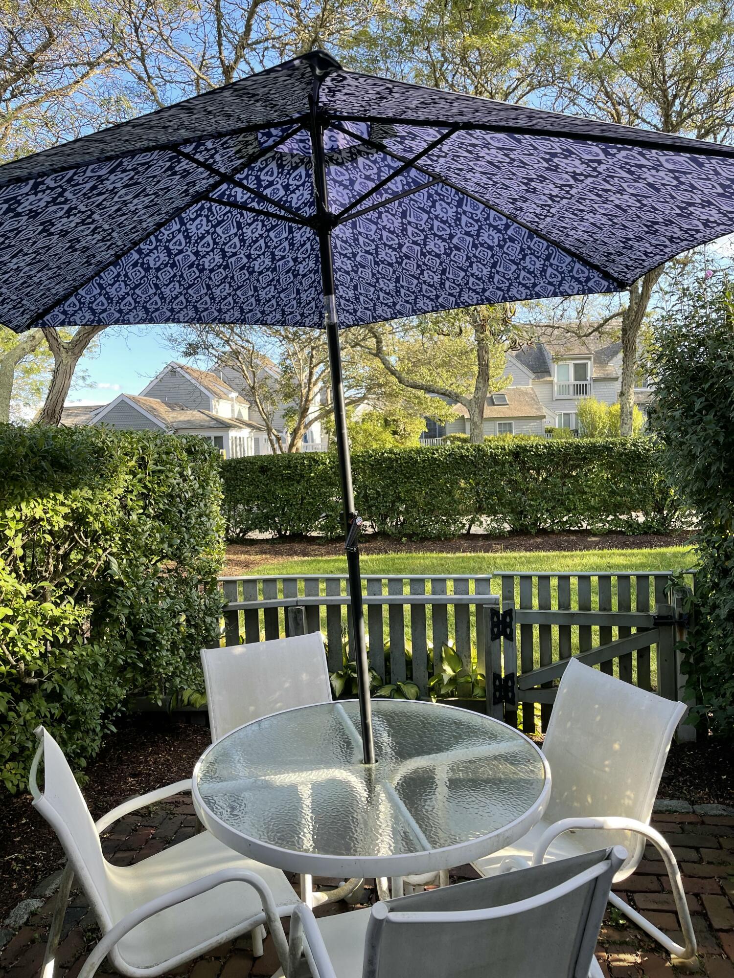 4 Colemans Way Mashpee, MA 02649 - Photo 4 of 27 a table and chairs in the patio
