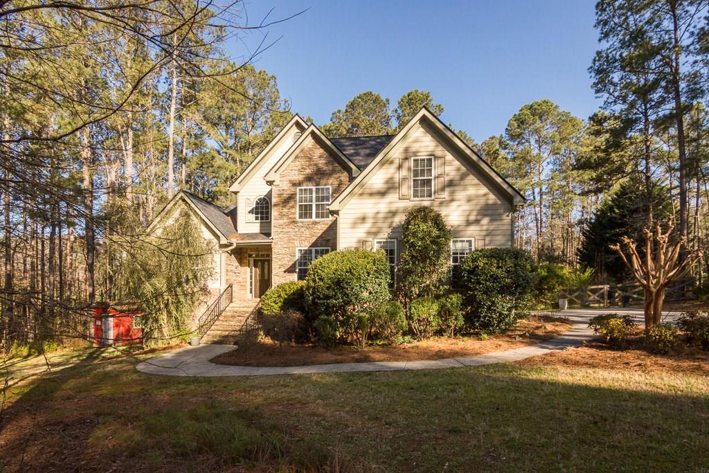 671 Hickory Grove Church Road Monroe, GA 30656 - Photo 1 of 1 a view of road with card and large trees