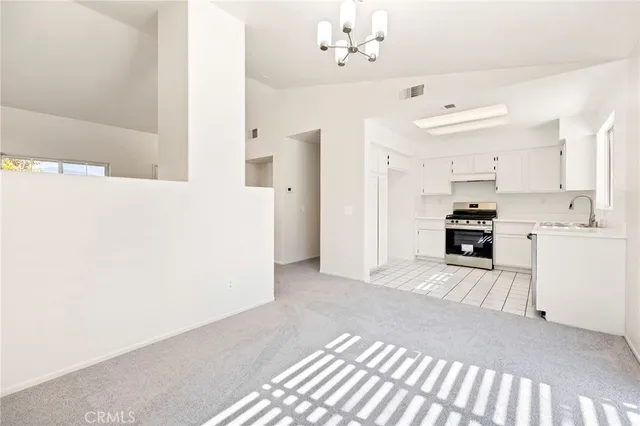 a view of a kitchen with a sink