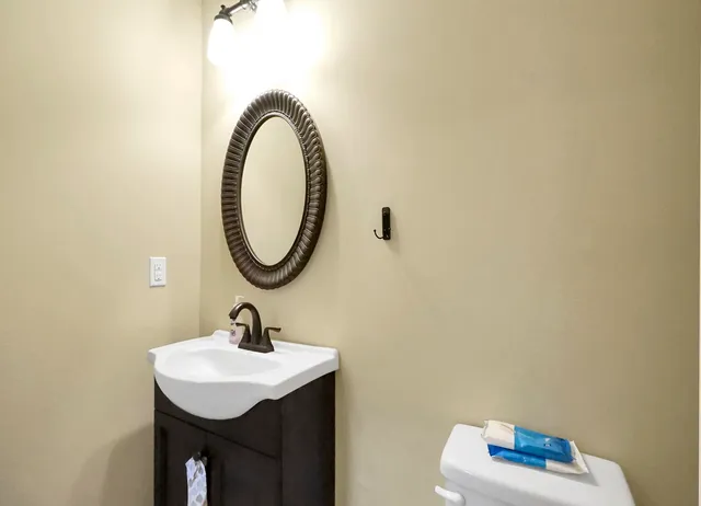 a living room with furniture and kitchen view