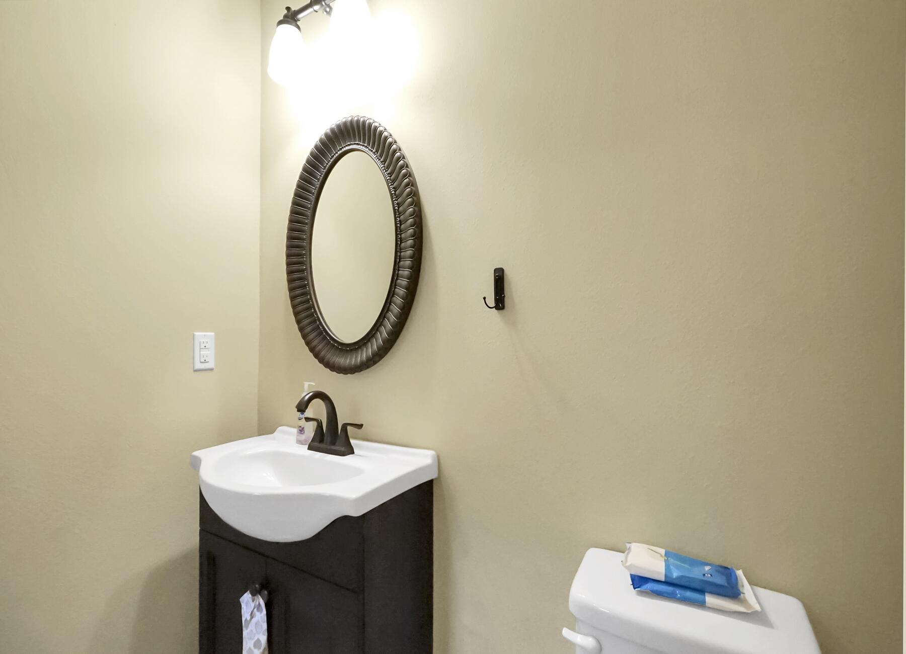 220 Wainwright Drive Crestview, FL 32539 - Photo 14 of 56 a bathroom with a sink a mirror and a toilet