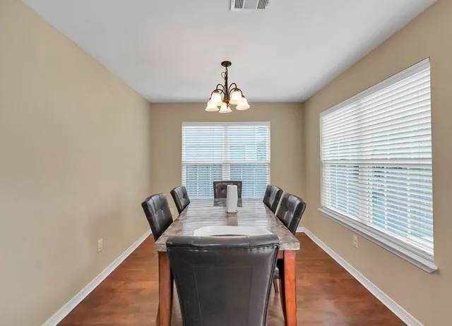 a view of a dining room with furniture