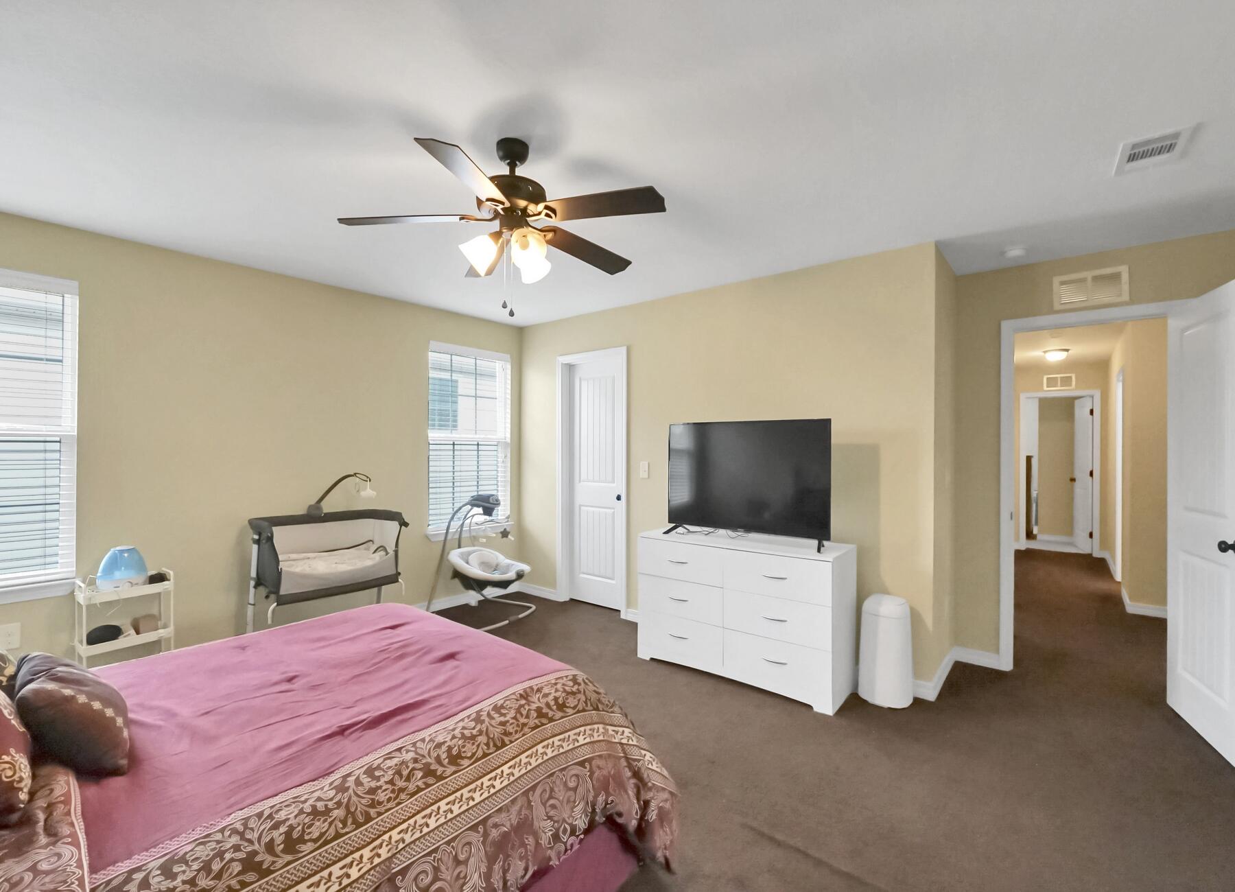 220 Wainwright Drive Crestview, FL 32539 - Photo 29 of 56 a bedroom with a bed and a tv