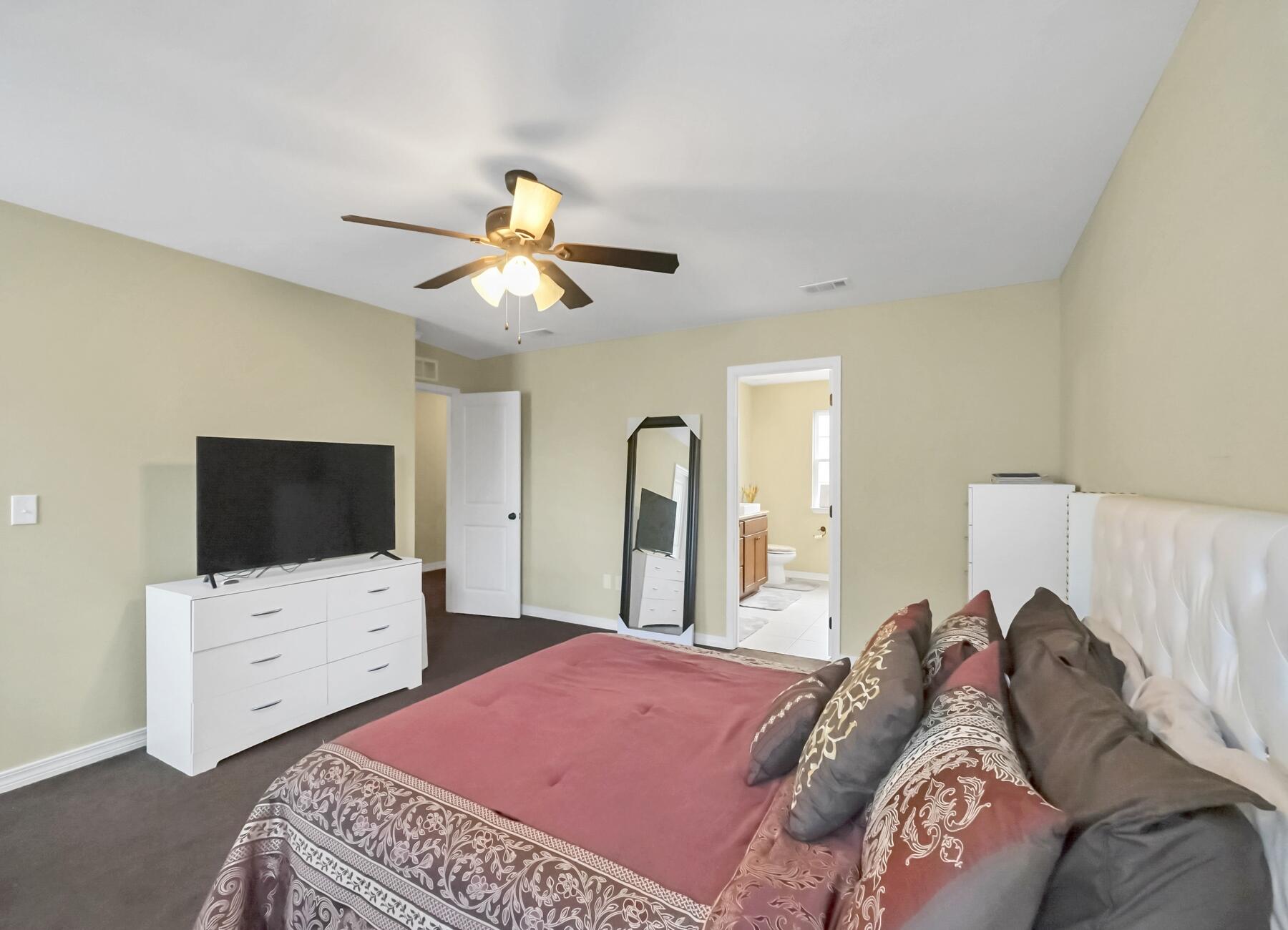 220 Wainwright Drive Crestview, FL 32539 - Photo 30 of 56 a bedroom with a bed and a flat screen tv