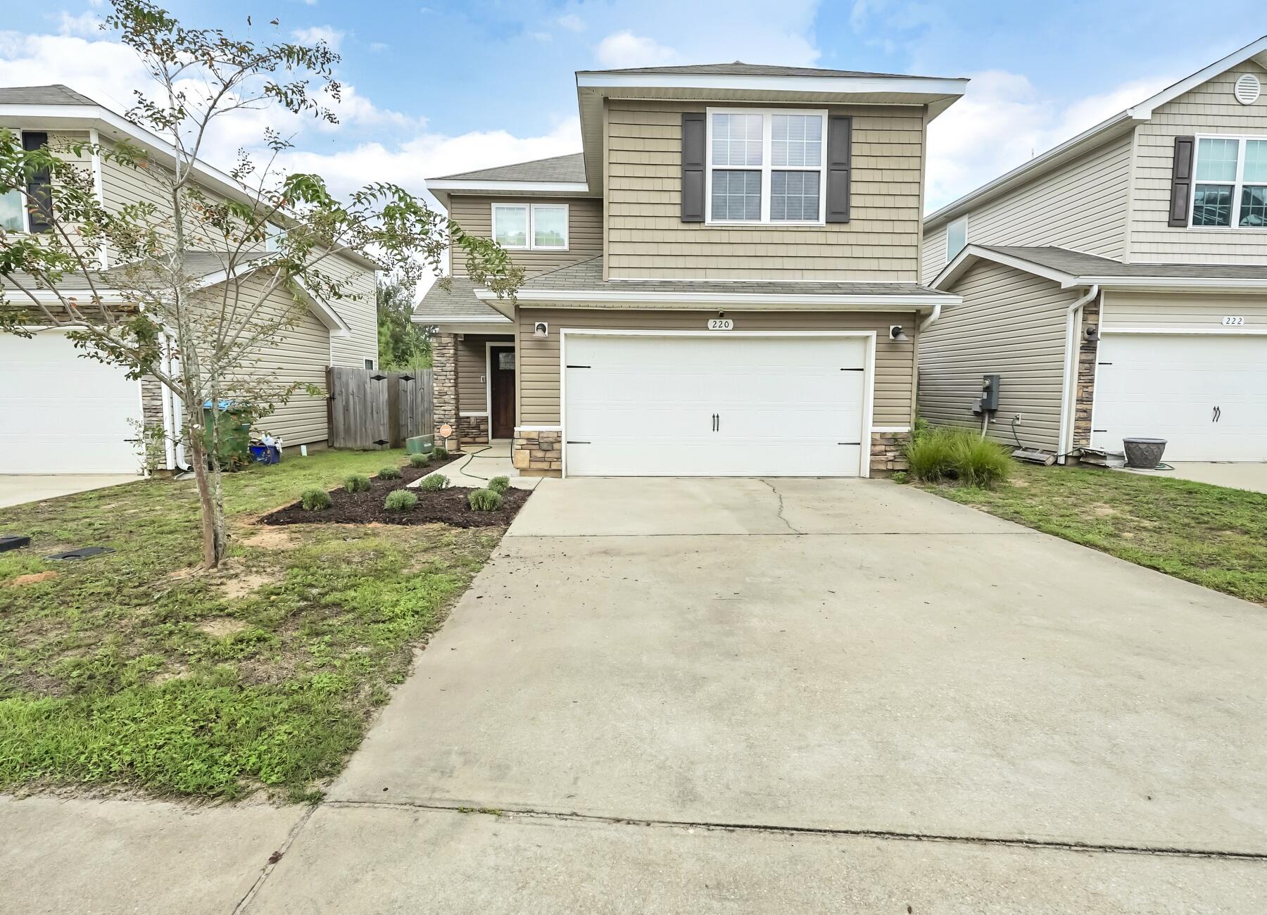 220 Wainwright Drive Crestview, FL 32539 - Photo 3 of 56 a view of a house with a yard