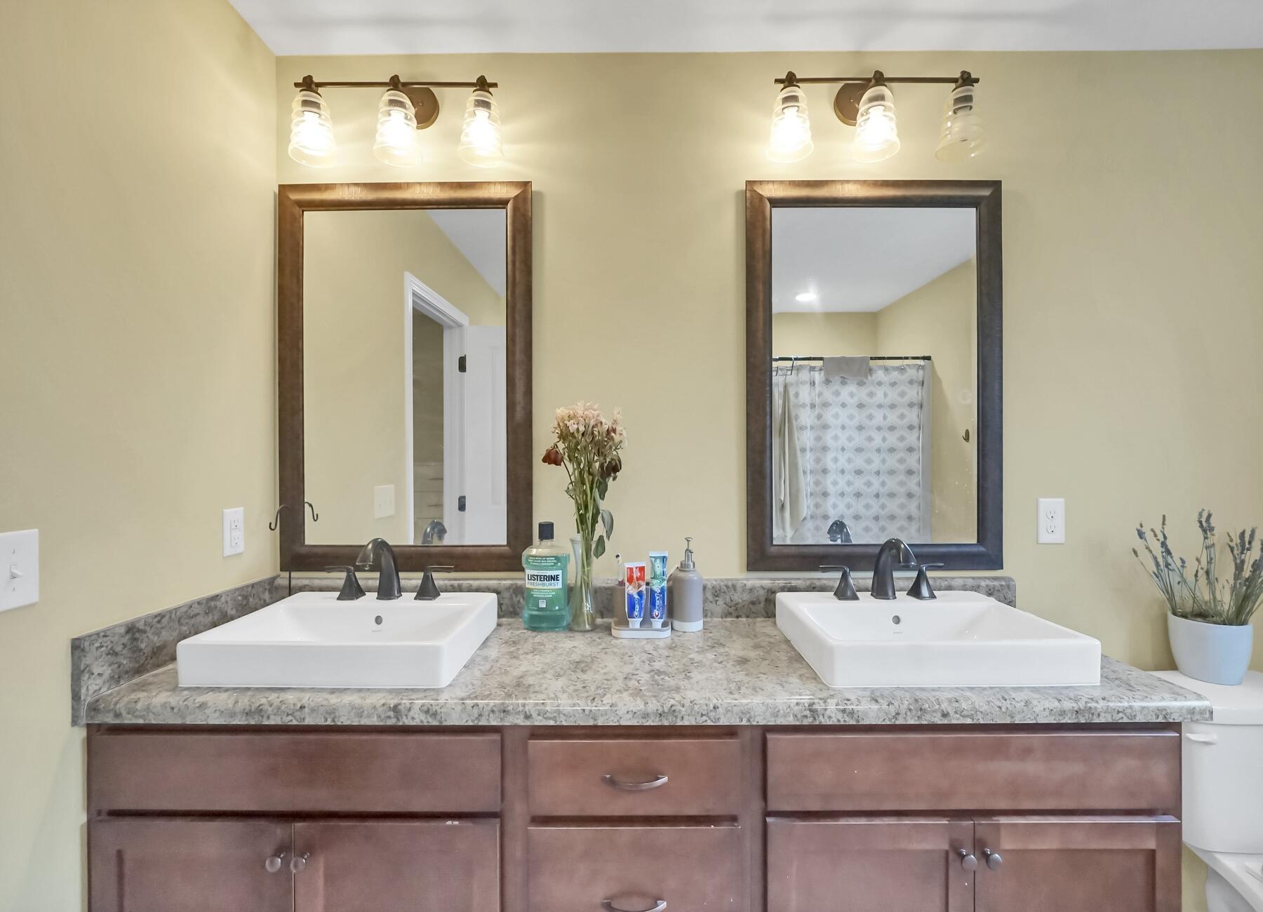 220 Wainwright Drive Crestview, FL 32539 - Photo 32 of 56 a bathroom with a granite countertop sink and a mirror