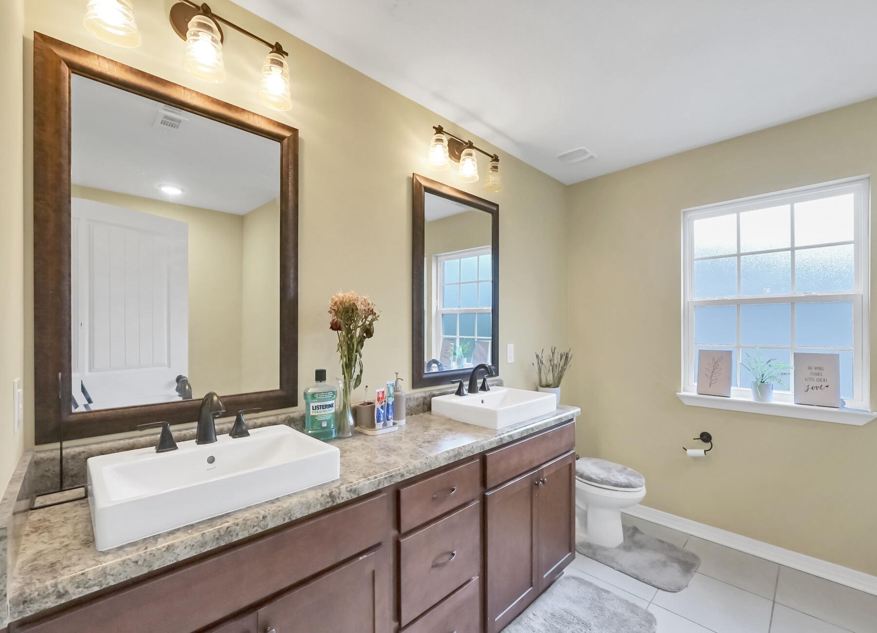220 Wainwright Drive Crestview, FL 32539 - Photo 33 of 56 a bathroom with 2 sink and a mirror