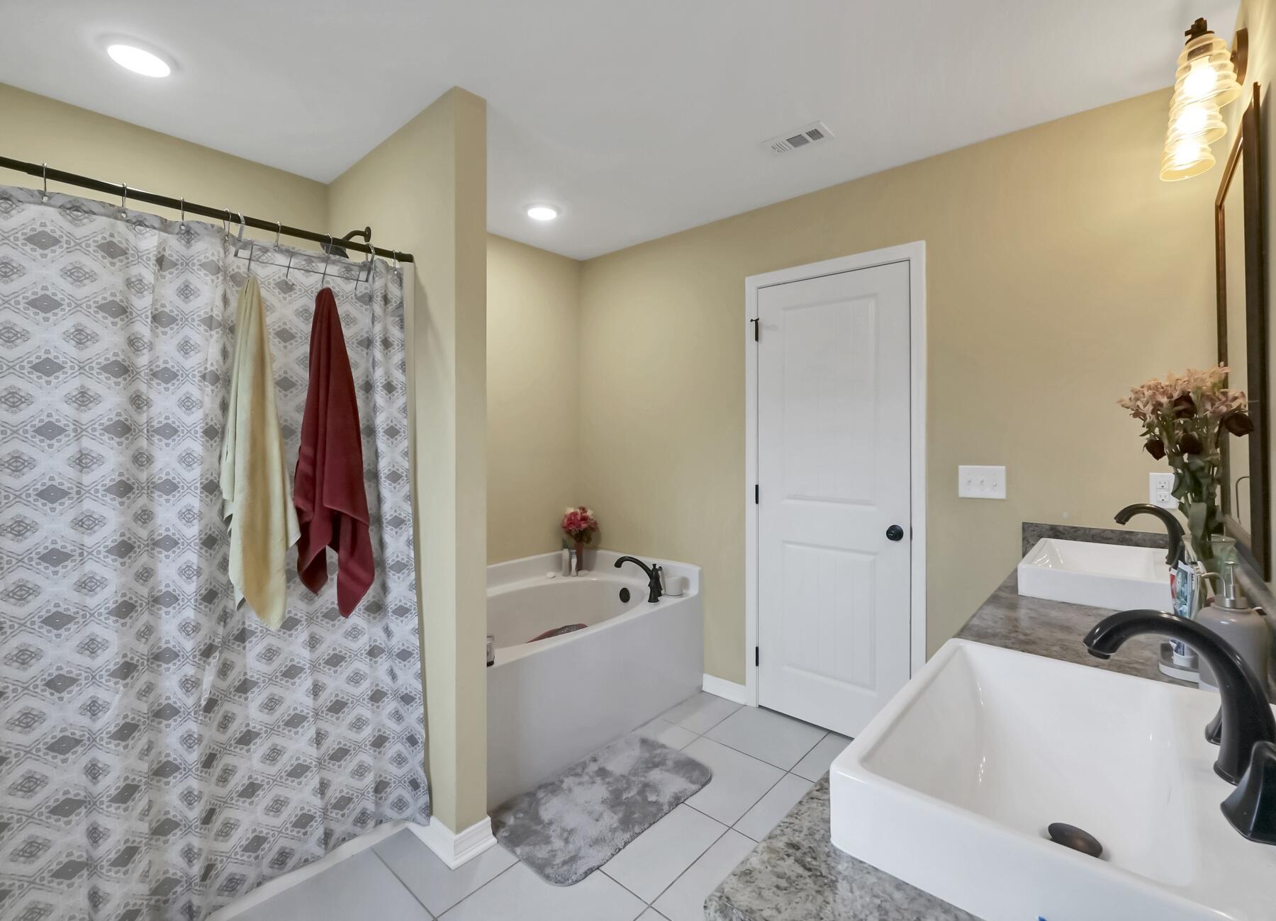 220 Wainwright Drive Crestview, FL 32539 - Photo 35 of 56 a bathroom with a tub and shower curtain